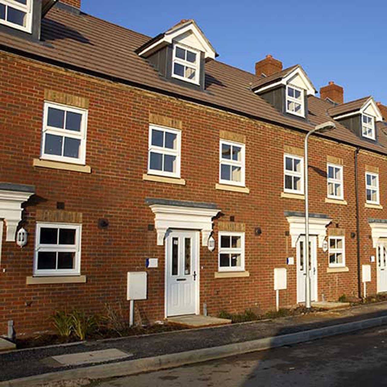 Empty row of terraced houses image