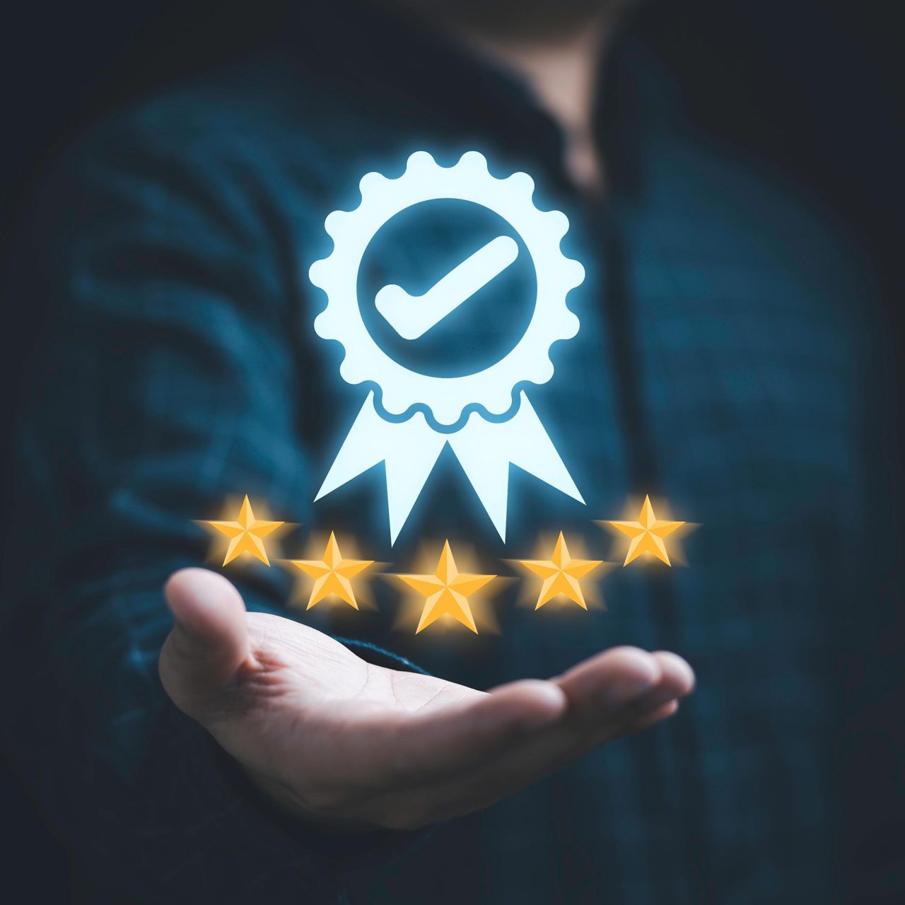 Man holding 5 stars and a rosette